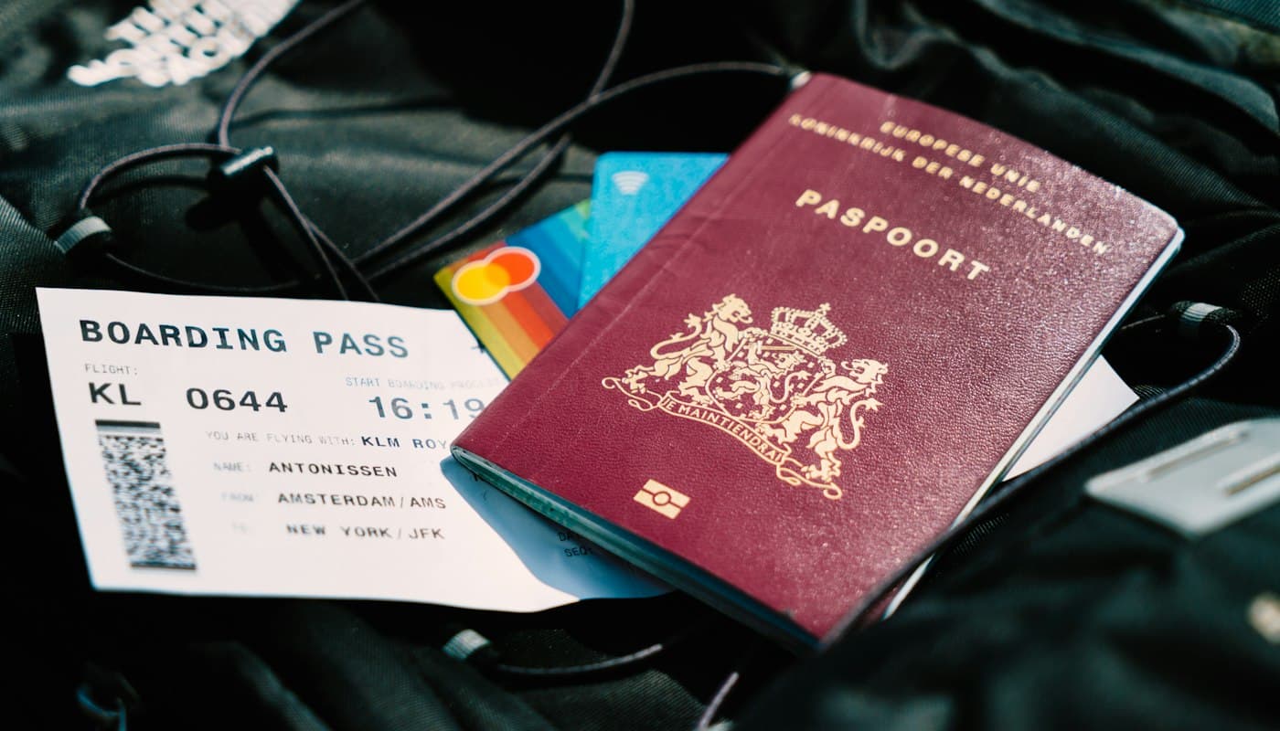 A passport resting on a boarding pass