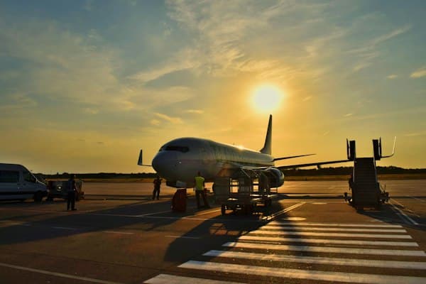 A plane at the gate at sunset