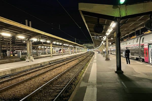 A TGV waiting at a platform at Paris Gare de Lyon at night