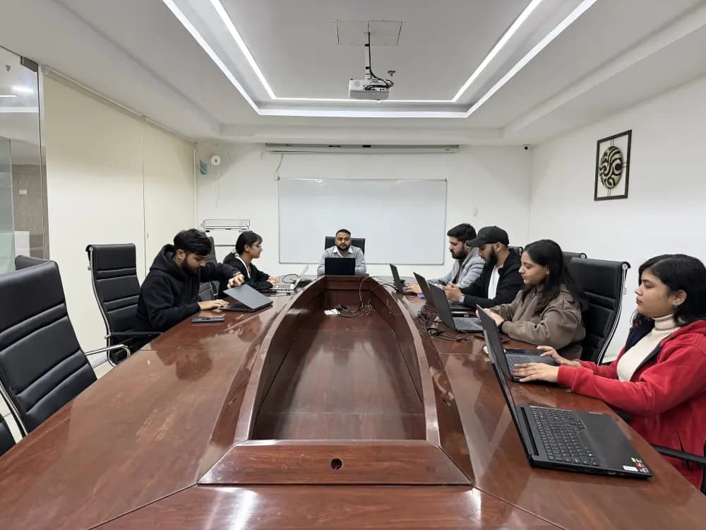 Atravelq travel specialists working together in a meeting room