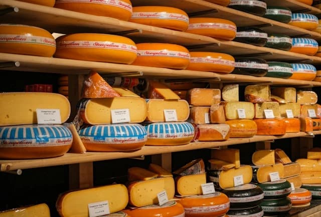 Cheese wheels on the racks