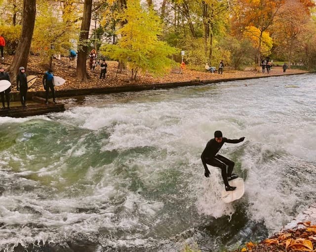 The Eisbach standing wave with a surfer on it