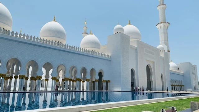 White marble domes and reflecting pool of Sheikh Zayed Grand Mosque