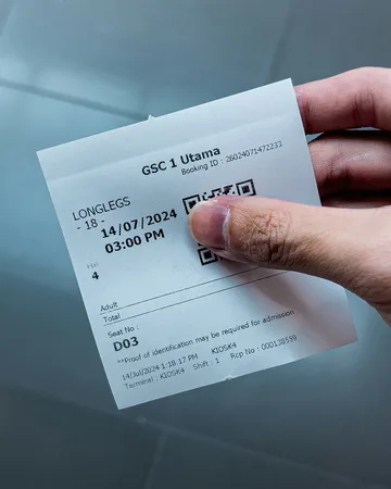 A receipt photographed in hand